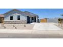 Charming single-story home with a well-manicured front yard and a two-car garage in a Gathering-friendly neighborhood at 317 S San Christo Ln, Casa Grande, AZ 85194