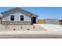 Charming single-story home with a well-manicured front yard and a two-car garage in a Gathering-friendly neighborhood at 317 S San Christo Ln, Casa Grande, AZ 85194