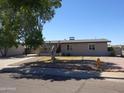 Charming single-story home with a covered carport and a low maintenance rock front yard at 3171 W Orchid Ln, Phoenix, AZ 85051