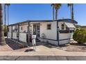 Charming single Gathering home in a park with desert landscaping and covered entryway at 4065 E University Dr # 228, Mesa, AZ 85205