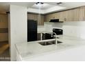 Modern kitchen featuring stainless steel appliances and bright countertops at 4242 N 69Th Dr # 1303, Phoenix, AZ 85033