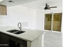 Kitchen with white countertops and stainless steel sink at 4242 N 69Th Dr # 1303, Phoenix, AZ 85033