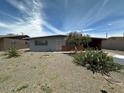 Charming single-story home with desert landscaping and covered parking at 513 S Cardinal Dr, Apache Junction, AZ 85120