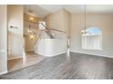 Open-concept home with a large staircase, wood floors, and high ceilings at 720 W Palo Verde St, Gilbert, AZ 85233