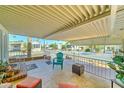 Inviting covered patio with comfortable seating, perfect for relaxing and enjoying the community views at 111 S Greenfield Rd # 547, Mesa, AZ 85206
