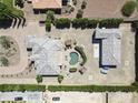 Expansive property features a private pool, detached garage, and mature landscaping at 16645 W Papago St, Goodyear, AZ 85338