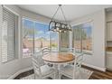 Charming breakfast nook with backyard view and modern lighting fixture at 1694 E Campbell Ave, Gilbert, AZ 85234