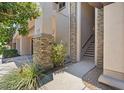 Inviting entryway with stone accents and lush landscaping welcomes you home at 20121 N 76Th St # 2058, Scottsdale, AZ 85255