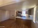 Spacious room with hardwood flooring, kitchen, and lots of potential at 2020 W Union Hills Dr # 240, Phoenix, AZ 85027