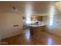 Spacious room with hardwood flooring, kitchen, and lots of potential at 2020 W Union Hills Dr # 240, Phoenix, AZ 85027
