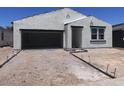 Charming single-story home with a stucco exterior, attached garage, and a modern design at 24104 W Bowker St, Buckeye, AZ 85326