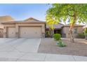 Charming single-story home with a three-car garage and desert landscaping at 26330 N 56Th Dr, Phoenix, AZ 85083