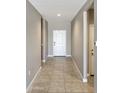 Inviting hallway with neutral paint, leading to the main living areas at 30776 W Earll Dr, Buckeye, AZ 85396