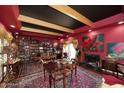 Eclectic living room with hardwood floors, colorful art, and many bookshelves at 4317 N 70Th St, Scottsdale, AZ 85251