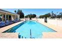 Sparkling pool with blue water and deck with lounge chairs in gated community at 4317 N 70Th St, Scottsdale, AZ 85251