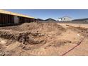 Construction site shows the dirt foundation for a new home in a residential neighborhood at 46850 W Old Timer Rd, Maricopa, AZ 85139