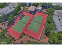 Aerial view of well-maintained community tennis courts surrounded by lush landscaping and trees at 5203 N 24Th St # 207, Phoenix, AZ 85016