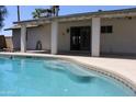 Inviting backyard pool and patio area, perfect for relaxing and entertaining outdoors at 5529 W Zoe Ella Way, Glendale, AZ 85306