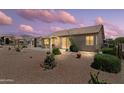 Desert landscaped backyard with covered patio and sliding glass doors for indoor/outdoor living at 6080 S Jojoba Ct, Gold Canyon, AZ 85118