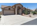 Charming single-story home with desert landscaping, a tile roof, and an attached garage at 6080 S Jojoba Ct, Gold Canyon, AZ 85118