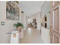 Welcoming foyer featuring tiled floors, arched doorways, and stylish decor at 6080 S Jojoba Ct, Gold Canyon, AZ 85118