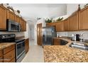 Spacious kitchen with stainless steel appliances, granite countertops, and ample cabinet space at 6080 S Jojoba Ct, Gold Canyon, AZ 85118