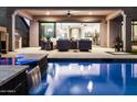 Backyard pool and patio area with a water feature and ample space for outdoor entertaining at 8633 E Kael Cir, Mesa, AZ 85207