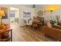 Cozy dining area features a round wooden table with seating and stylish accents at 13807 N Garden Court Dr, Sun City, AZ 85351