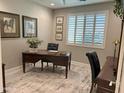 Cozy office with natural light, plantation shutters, and neutral colored walls at 16822 W Catalina Dr, Goodyear, AZ 85395
