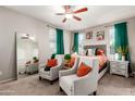 Bright main bedroom with neutral tones, ceiling fan, and ample natural light at 17717 W Mandalay Ln, Surprise, AZ 85388