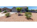 Quaint single-Gathering home boasting easy-care landscaping and a convenient two-car attached garage at 30388 N Opal Dr, San Tan Valley, AZ 85143