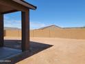 Covered patio view of a large, private backyard enclosed with brick walls, perfect for outdoor entertaining at 311 S San Gregorio Ln, Casa Grande, AZ 85194