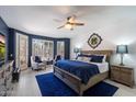 Inviting main bedroom with a ceiling fan, calming colors, and plenty of natural light at 4569 E Lariat Ln, Phoenix, AZ 85050