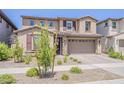 Inviting two-story home with manicured front yard, a two-car garage, and a neutral color palette at 4607 S Venus --, Mesa, AZ 85212