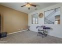 Bright living room offers views to the staircase and has neutral paint and carpeted floors at 4607 S Venus --, Mesa, AZ 85212