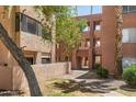 Condo courtyard showing walkways, and desert landscaping at 540 N May -- # 2148, Mesa, AZ 85201