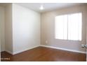 Bright bedroom with wood floors and a large window at 7425 N 69Th Ln, Glendale, AZ 85303