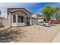 Well-maintained single-story home with a cozy entrance and attached two-car garage at 9124 W Williams St, Tolleson, AZ 85353