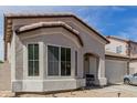 Close-up of the charming home displaying the architecture and big front window at 9124 W Williams St, Tolleson, AZ 85353