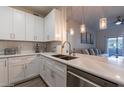 Open concept kitchen with stainless steel appliances, undermount sink and white shaker cabinets at 9600 N 96Th St # 171, Scottsdale, AZ 85258