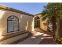 Inviting walkway that leads to the front door, accented by lush landscaping at 10429 N 101St St, Scottsdale, AZ 85258