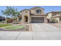 Inviting two-story home featuring a two-car garage, tile roof, and low-maintenance landscaping for enhanced curb appeal at 10925 E Toluca Ave, Mesa, AZ 85212