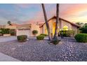 Inviting single-Gathering home features a well-manicured yard and charming desert landscaping at 11085 E Mary Katherine Dr, Scottsdale, AZ 85259
