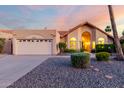 Inviting single-Gathering home features a well-manicured yard and charming desert landscaping at 11085 E Mary Katherine Dr, Scottsdale, AZ 85259