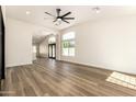 Expansive living area features wood floors, fresh paint, many windows, and lots of natural light at 1710 S Aaron --, Mesa, AZ 85209