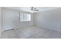 Bright living room featuring tile flooring and a ceiling fan at 2030 E Alder Cir, Mesa, AZ 85204