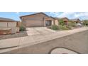 Cozy single-Gathering home featuring a spacious driveway and low-maintenance landscaping at 25787 W Allen St, Buckeye, AZ 85326