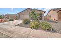 Attractive home with a manicured lawn and stone accents, enhancing curb appeal at 25787 W Allen St, Buckeye, AZ 85326