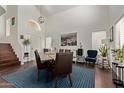 Spacious dining room showcasing high ceilings, wood floors, a large table, and decor at 3222 E Cortez St, Phoenix, AZ 85028