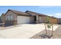 Charming single-story home with a two-car garage, easy-care landscaping, and a concrete driveway at 328 S San Christo Ln, Casa Grande, AZ 85194
